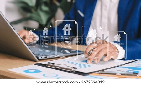 Businessman using digital tablet with virtual property documents and checklist icons. Concept of real estate technology, online mortgage, smart contract, and house investment.