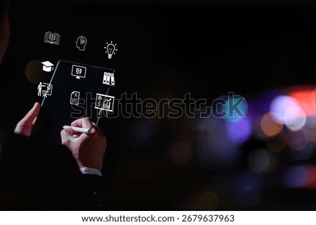 Businessman using digital tablet with virtual education and business icons, representing online learning, innovation, e-learning, professional training knowledge development.