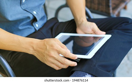 Businessman using digital tablet,hand touching screen on digital tablet