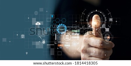 Businessman using fingerprint indentification to access personal financial data. for E-kyc (electronic know your customer), biometrics security, innovation technology against digital cyber crime