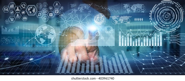 Businessman using futuristic screens with charts and graphics