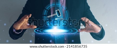 Businessman using hand holding hammer icon,futuristic line network, concept bid winner highest bidder in final lift,public sale property auctioned business competition,e-auction and online bidding