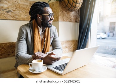 Businessman Using His Laptop In The Cofee Shop. Business Concept