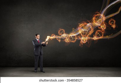 Businessman using his tablet pc and glowing light out of screen