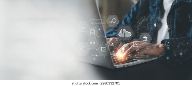 Businessman is using a laptop to access the cloud computing system , Storage and data transfer Cloud network , Cloud technology. Networking and internet service concept - Powered by Shutterstock - Get 15% off with code: PIKWIZARD15
