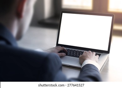 businessman using laptop with blank screen.