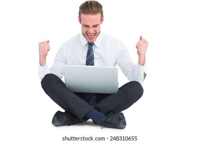 Businessman using laptop and cheering on white background