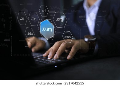 Businessman using laptop to choosen sub domain name dot com or .com to registeration the commercial website.