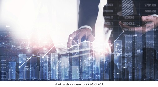 Businessman using laptop computer analyzing sales data, financial report and economic growth graph chart. Business strategy and solution. Digital marketing and business growth - Powered by Shutterstock
