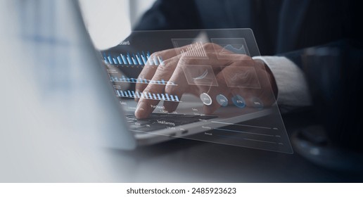 Businessman using laptop computer analyzing sales data and financial growth graph chart report. Business planning, strategy and development. Financial accounting. market research, data analysis - Powered by Shutterstock