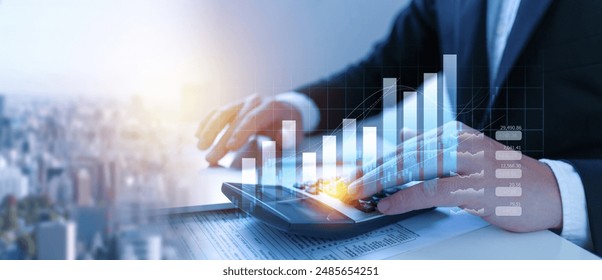 Businessman using the laptop computer and calculator tax online return form for payment, Accounting financial research, government taxes and calculation tax return concept.