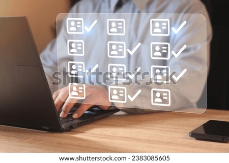 Businessman using laptop computer with correct tick sign mark and resume for approve person to human recruitment and hire concept.