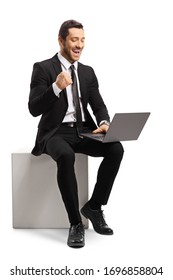 Businessman Using A Laptop Computer And Gesturing Happiness Isolated On White Background