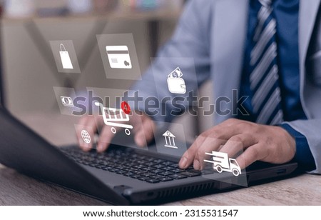 Businessman using laptop computer to input order with icons shopping trolley, credit card, delivery truck, bank, shopping basket, wallet for online shopping and e-commerce technology concept.