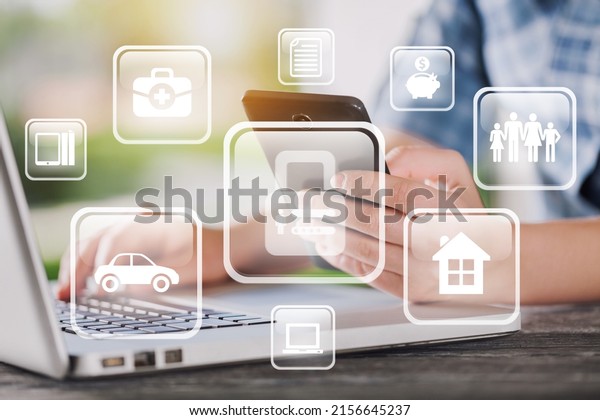 Businessman using a\
laptop computer to insurance online for car, travel, family and\
life, financial and health\
icon.