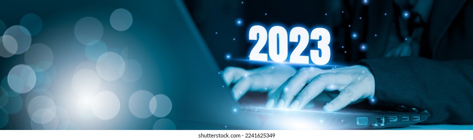 Businessman using laptop computer search 2023 trends,happy new year concept digital trends,industry and business trend of world full modernity advanced technology,artificial intelligence or AI,banner - Shutterstock ID 2241625349