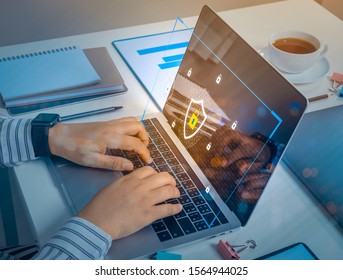 Businessman using a laptop computer with technology cybersecurity and privacy concept. protection and safe data for global network security.
