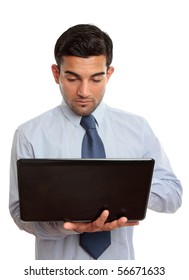 Businessman using a laptop computer.  White background.