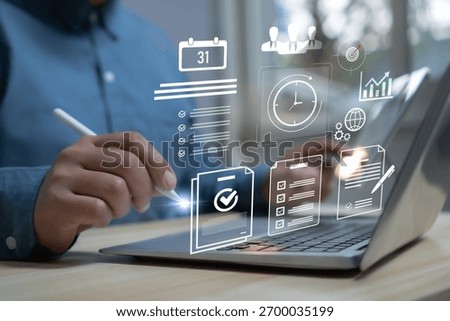 Businessman using laptop with digital task management system showing checklist, schedule, clock, and data icons productivity, workflow planning, time management, and business efficiency concept.