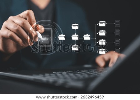 Businessman using a laptop to document management concept, online documentation database and digital file storage system or software, records keeping, database technology, file access, doc sharing.