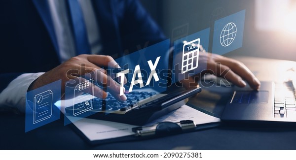 Businessman using\
the laptop to fill in the income tax online return form for\
payment.\
Financial research,government taxes and calculation tax\
return concept. Tax and Vat\
concept.
