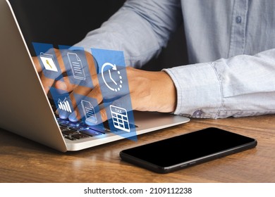 Businessman using a laptop to fill individual income tax online for tax payment. Tax day and calculation tax return - Shutterstock ID 2109112238