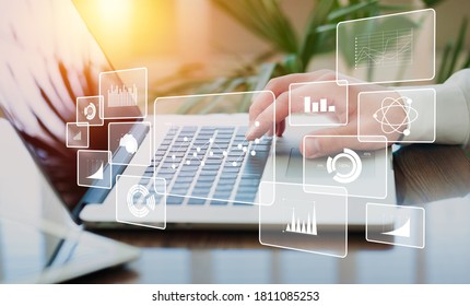 Businessman using a laptop with finance infographic - Shutterstock ID 1811085253