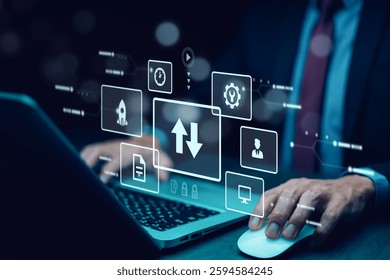 Businessman using a laptop with futuristic digital interface. Concept of cloud computing, data transfer, cybersecurity, and artificial intelligence. Innovation in business technology.