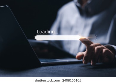 Businessman using laptop with loading bar on virtual screen to install or download software. progress bar, update, upgrade.