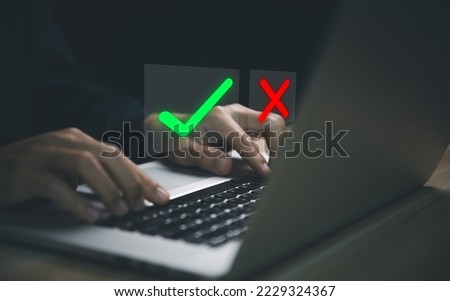 Businessman using laptop showing right and wrong sign have an idea to decide to vote think yes or no Business options for difficult situations true and false symbol