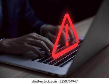 Businessman using laptop showing warning triangle and exclamation sign icon Warning of dangerous problems Server error. Virus. Maintenance concept. caution internet technology network security - Shutterstock ID 2250764947