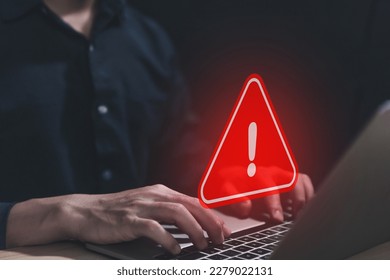 Businessman using laptop showing warning triangle and exclamation sign icon Warning of dangerous problems Server error. Virus. Maintenance concept. caution internet technology network security