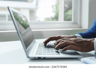 Businessman using laptop and tablet Data graph document to analyze stock data Financial investment to check company profits startup business idea - Shutterstock ID 2367174581
