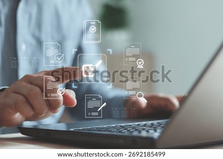 Businessman using laptop with virtual document checklist icon, representing digital approval, online form submission, task management and workflow automation in modern technology.