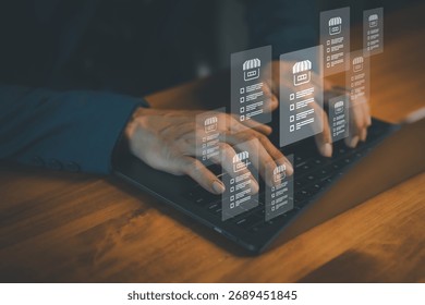 Businessman using laptop with virtual interface of online store management system, illustrating e-commerce analytics, digital marketing, inventory control, and business technology innovation concept.