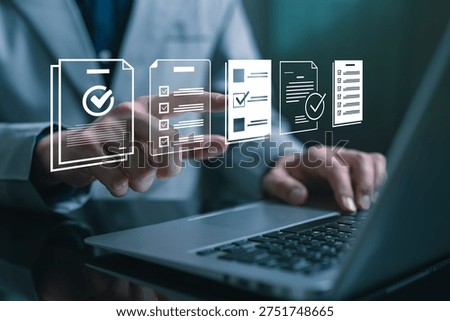 Businessman using laptop while selecting digital checklist documents on virtual interface, representing workflow management, task tracking, document verification and business process automation.