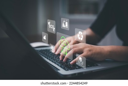 Businessman using laptops and touch recycle symbol with virtual modern reduce CO2 emission concept with icons, global warming emissions carbon footprint climate change to limit global warming, energy