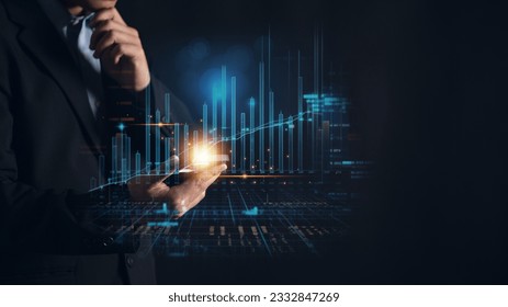 Businessman using a mobile phone with a hologram business growing graph. Concept of technology-driven growth and success in the modern business world - Shutterstock ID 2332847269