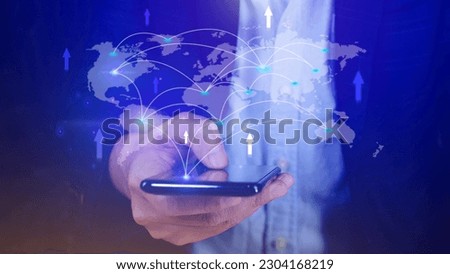 Businessman using mobile phone and laptop computer to money transfers and currency exchanges between countries of the world, online banking interbank payment concept.