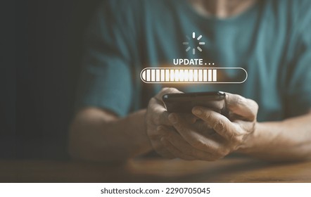 Businessman using mobile phone loading data with loading bar icon over a wireless , update concept and business transformation Loading icon on screen. - Powered by Shutterstock