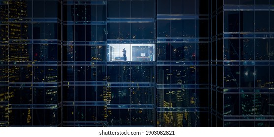 Businessman using mobile phone to talk business in office. View from the outside 3D rendering commercial skyscraper. - Shutterstock ID 1903082821