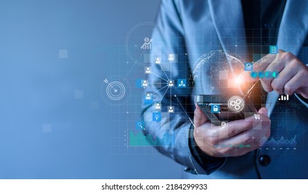 Businessman using mobile smartphone on global network connection on investor and customer with sale data exchange and development of business. Technology and digital marketing. Financial and banking.  - Shutterstock ID 2184299933