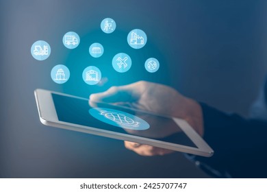 Businessman using mobile tablet for logistics with map and logistics icons and supply chain management.