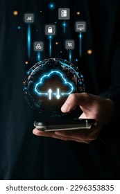 Businessman is using a mobilephone to access the cloud computing system, cloud computing, big data, internet of things, business processes, various storage systems