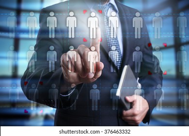 Businessman Using Modern Computer, Pressing Human Icon On Virtual Screen. Human Resource, HR, Team Building, Recruitment, Headhunting, Talent Management.