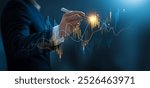 Businessman using pen touch candle chart financial growth of business and world economy. Stock market price increase. Stock market investment analysis, financial risk management and investment.