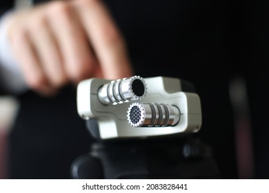 Businessman Using A Portable Sound Recording Device At A Meeting. Business And Technology Concept