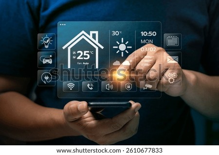 Businessman Using Smart Home Interface on Transparent Screen to Control Temperature, Lighting, and Smart Devices with Innovative Home Automation Technology for Comfort and Energy Efficiency