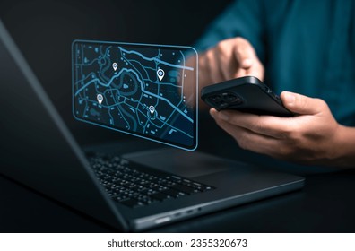 Businessman using smartphone and computer to search map with geolocation points. Synchronize GPS, Mark destination trip app and find business places by online map system, Exploring target location.  - Shutterstock ID 2355320673