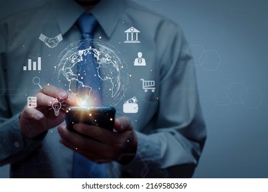 Businessman using smartphone connecting on globe icon, big data access concept with internet technology online transaction, e-wallet, banking, document, investment, communication.